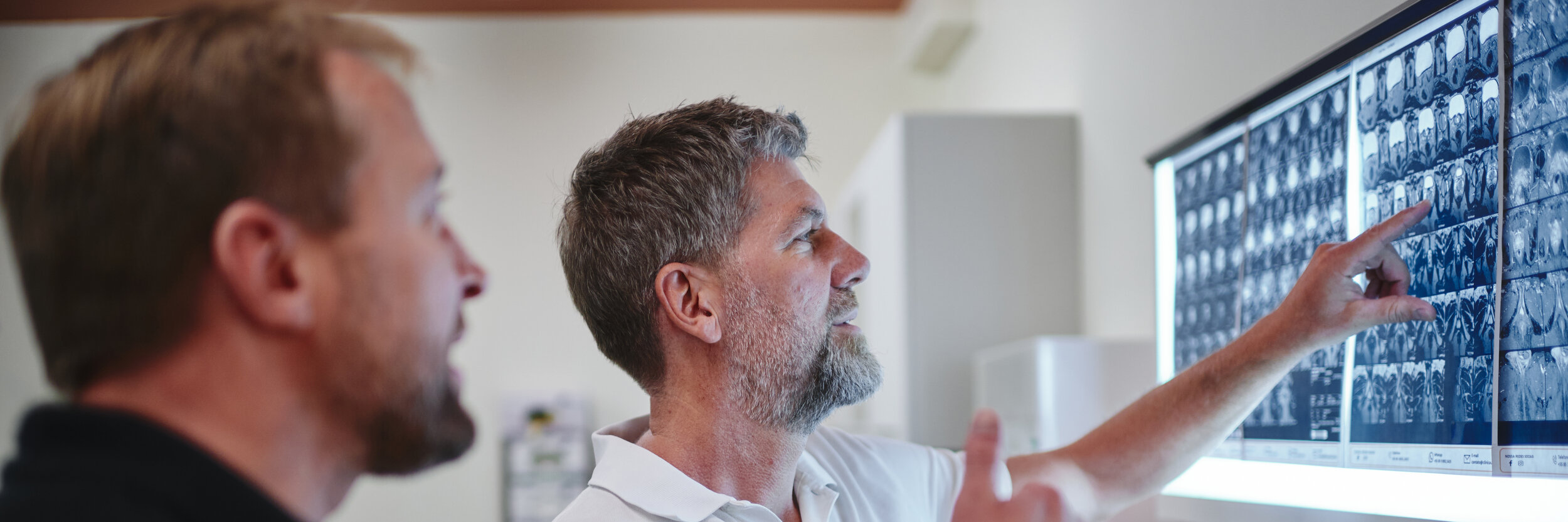 Dr Martin Loehr in consultation with a patient