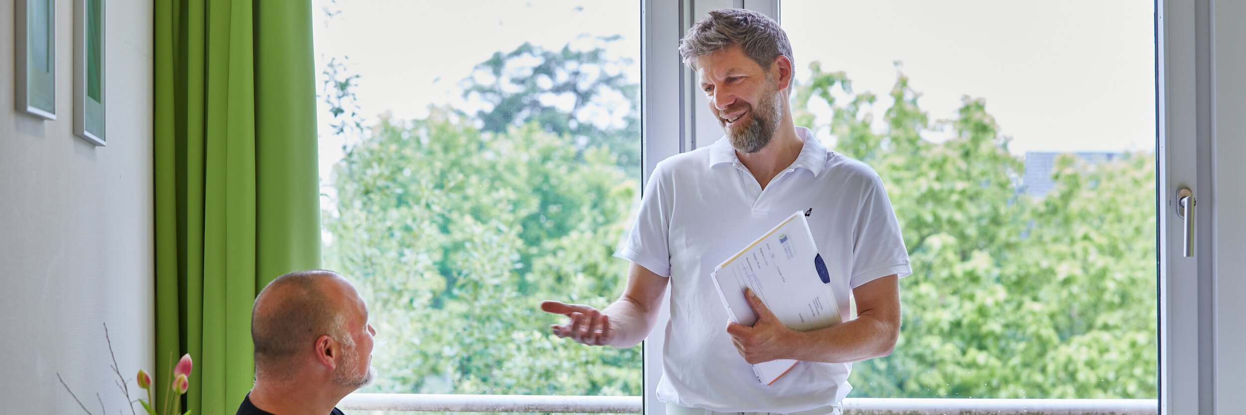 Dr Martin Loehr in consultation with a patient