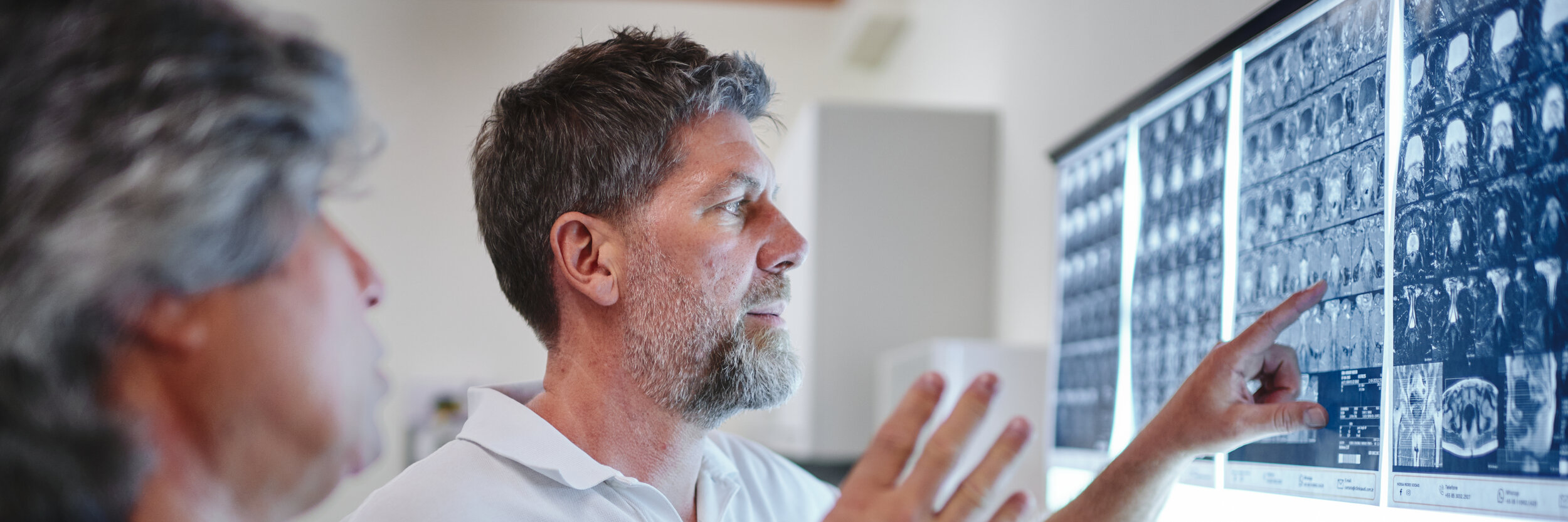 Dr Martin Loehr in consultation with a patient